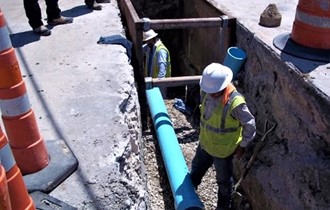 Crew replacing water main.